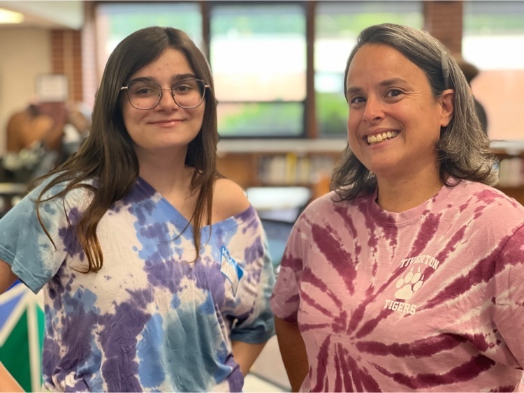 2 young women wearing tie-dye shirts