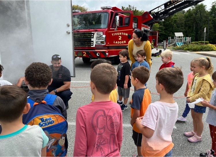 firefighters talking with children